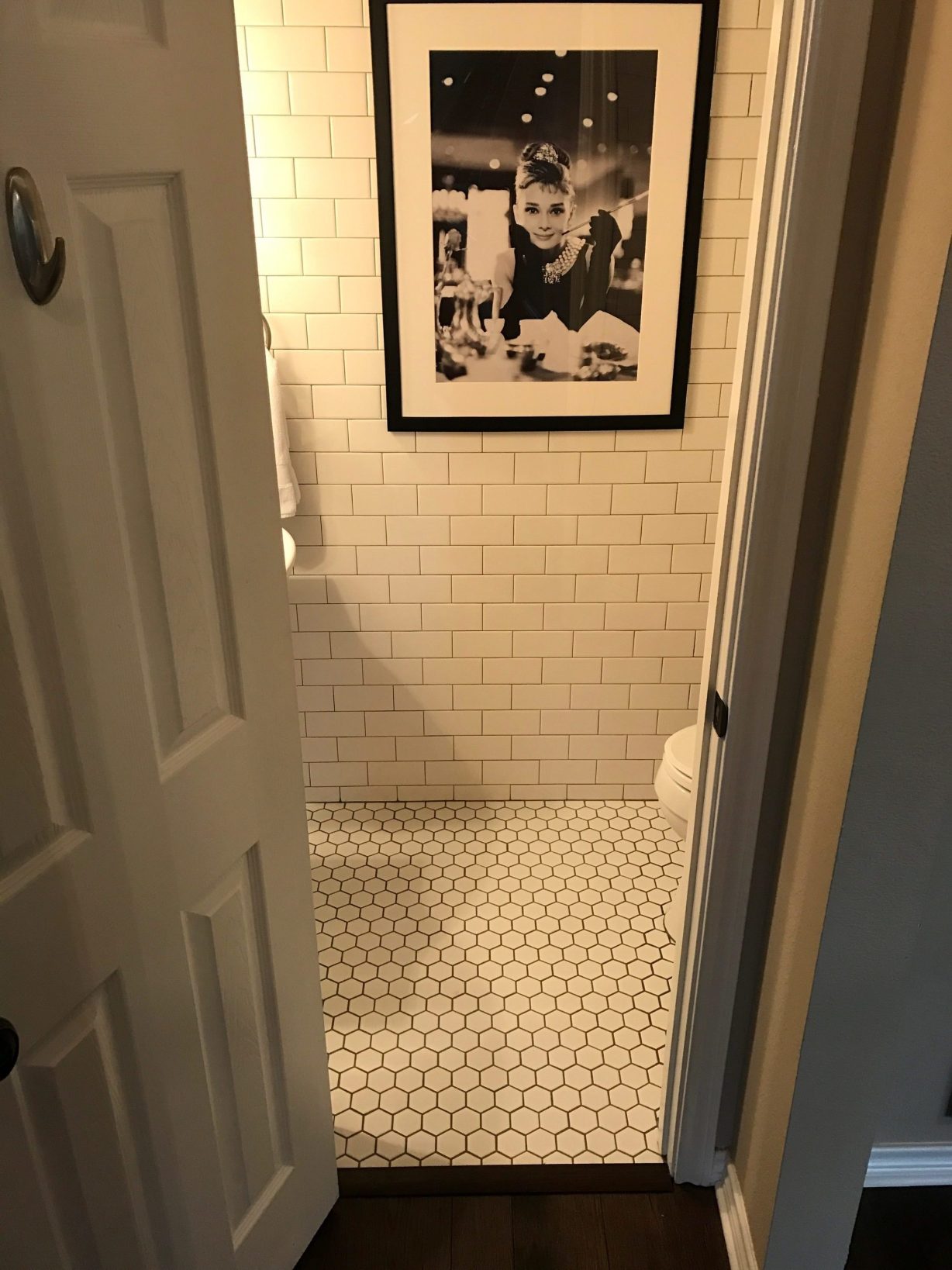 subway tile floor to ceiling bathroom