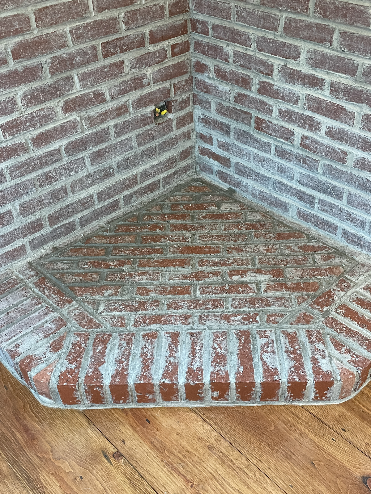 DIY Corner brick fireplace hearth