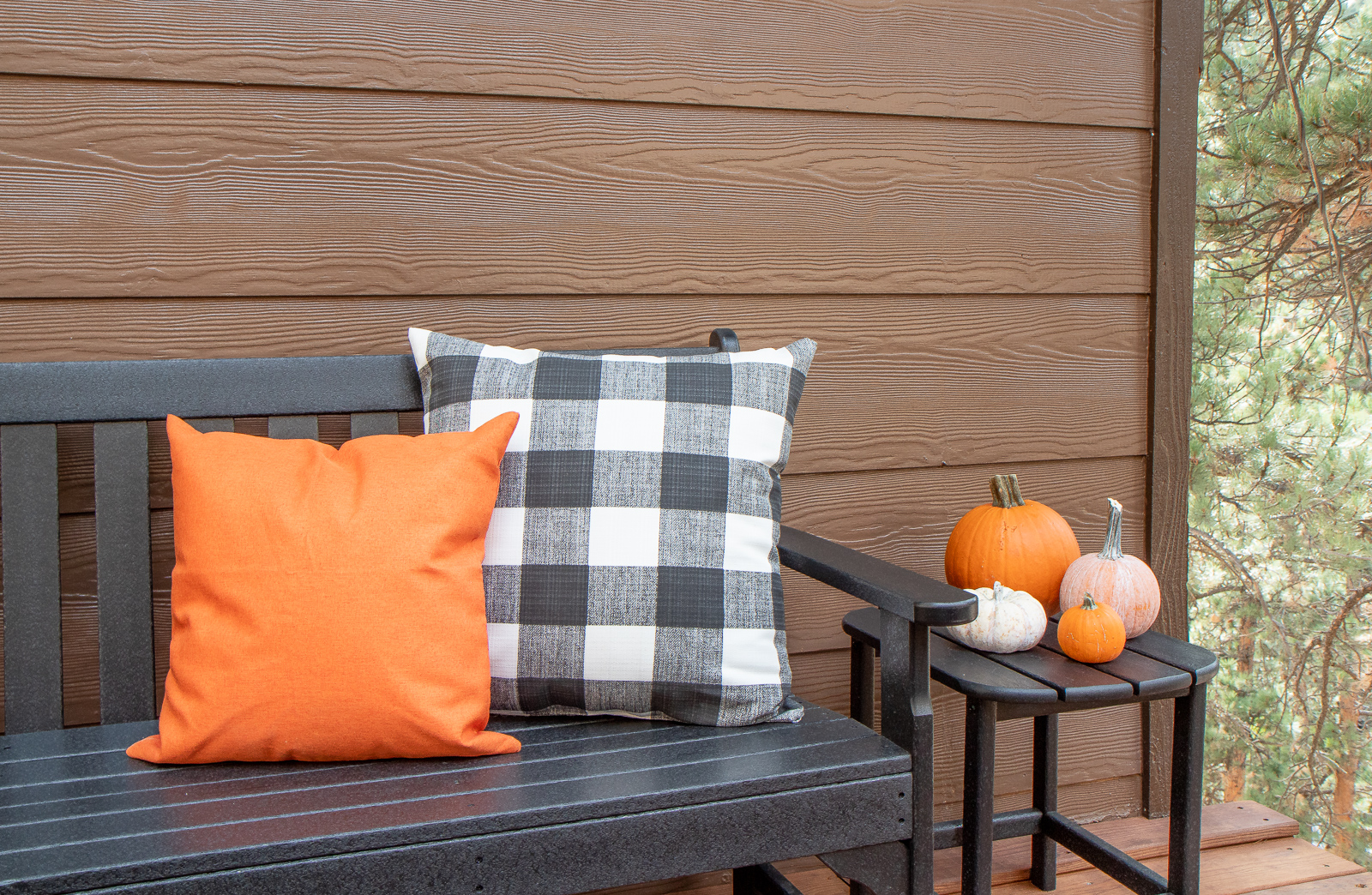 Outdoor orange and buffalo plaid pillows